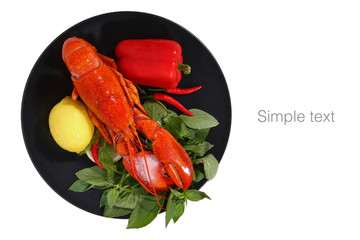 Popular seafood canadian lobster, The steamed canadian lobster served with herb on black plate isolated on white background with clipping path. Raw canadian lobster for Tom Yam.