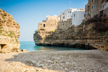 Fototapeta na wymiar The Bay of Polignano a Mare Built on the Cliff near Bari, in Italy