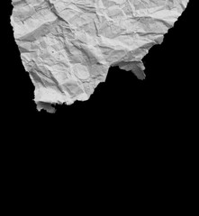 Ripped paper on black background, space for advertising copy.