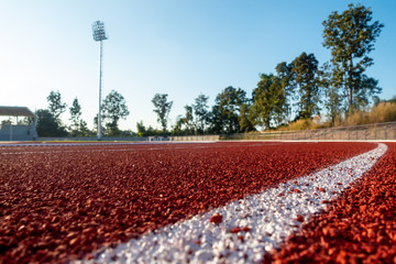 Red running track in stadium