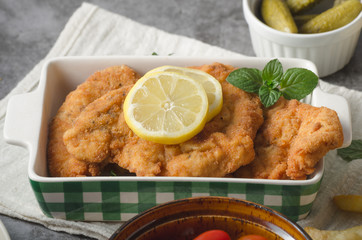 Homemade german schnitzel with pickles