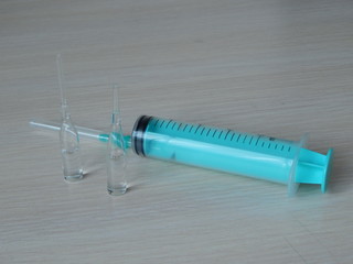 syringe on black background