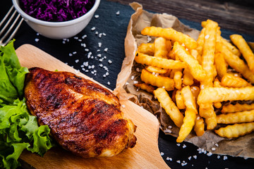 Grilled chicken breast, French fries and vegetables