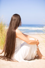 Fototapeta na wymiar Beautiful teen girl at beach on sunny day, smiling
