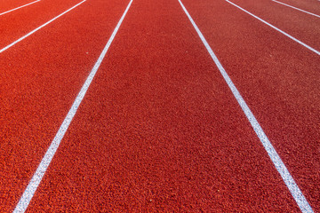 Red running track in stadium