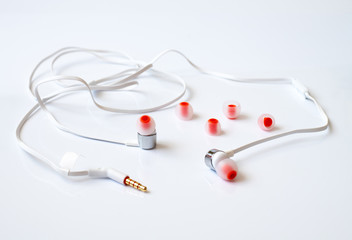 The white channel earphones on a white background