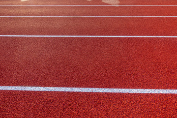 Red running track in stadium