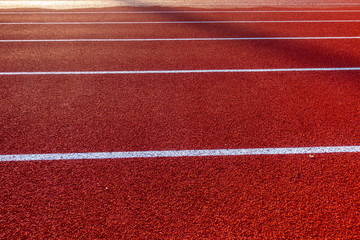 Red running track in stadium