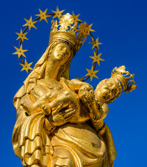 a golden statue of Madonna with a baby, Plague Column, Pilsen, Czech Republic