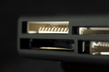 Card reader. Ports for various memory card formats closeup. Shallow depth of field