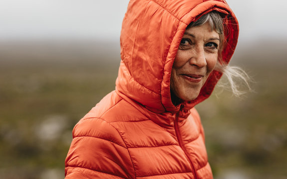 Portrait of a senior woman wearing hooded jacket