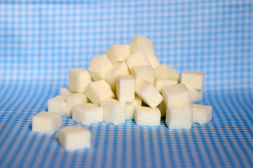 a heap of sugar in cubes of sugar
