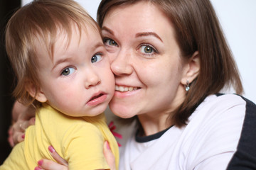 A happy mom and curious daughter