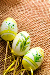 Easter decorated eggs with sackclouth vintage retro background 