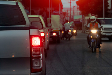 Pick up car silver color on the road at evening on rush hours in Thailand.