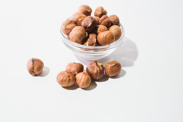 Fototapeta na wymiar The top view of hazelnuts isolated on white background
