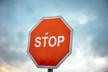 Stop sign with bullet holes