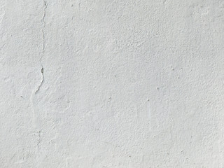 old white plaster wall with crack