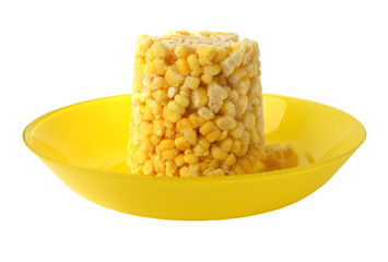 Frozen corn on a yellow plate
