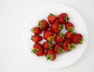 strawberries on white tableware