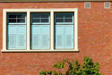 wood window on brick wall