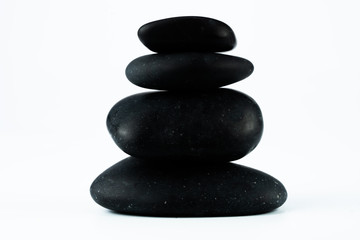 Obraz na płótnie Canvas massage equipment and black stones