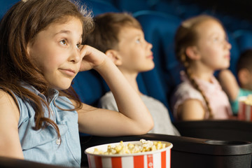 Kids looking bored while at the cinema