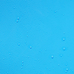 water drop on blue plastic texture