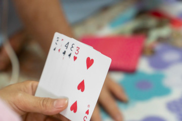 Playing cards in the hands