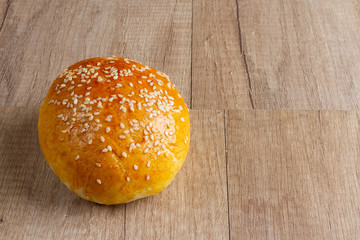 burger rolls on a light wooden background
