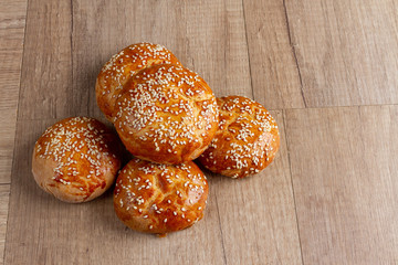 burger rolls on a light wooden background