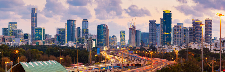 Fototapeta na wymiar Panorama Of Tel Aviv Skyline City And Ayalon Freeway At Sunset