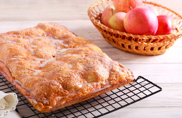 Glazed apple pie on wire rack