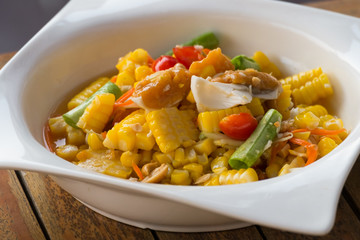 thai style spicy salad with yellow corn.