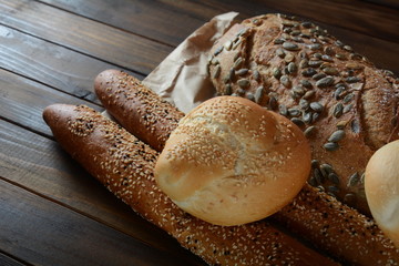 Bakery. Fresh fragrant baked bread. Homemade bread on wooden background