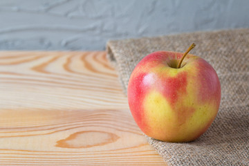 Fresh apple on a wooden table