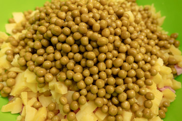 Green peas in a dish as a background