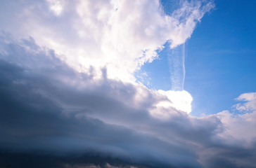 Scary epic sky with menacing clouds. Hurricane wind with a thunderstorm. Stock background, photo