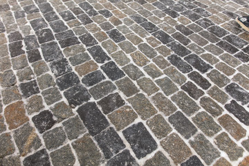 Fototapeta premium The stone blocks cleared of snow as a background