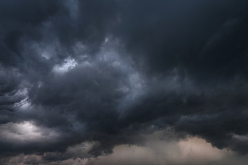 Scary epic sky with menacing clouds. Hurricane wind with a thunderstorm. Stock background, photo