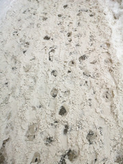 Footprints in the snow as an abstract background
