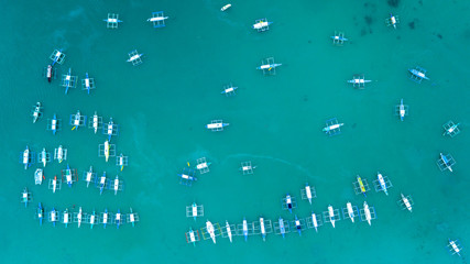 Aerial shot of local boats in El Nido Beach, Palawan, Philippines