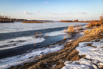 Deep river on the eve of ice drift in the spring in March.