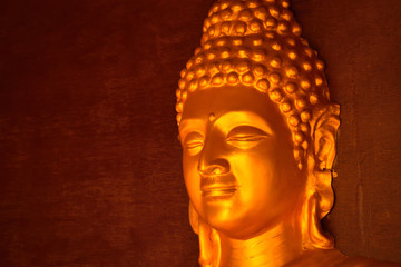 Golden colored idol of lord Buddha