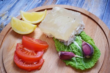 Aspic of chicken and vegetables on wooden background.