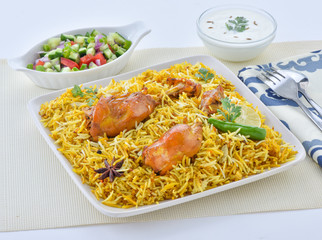 Chicken Biryani, a yummy & fluffy rice dish with spicy savory chicken pieces with salad.