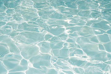 Texture of water in swimming pool for background