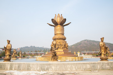 Fototapeta na wymiar chinese god statue and on lotus flower statue