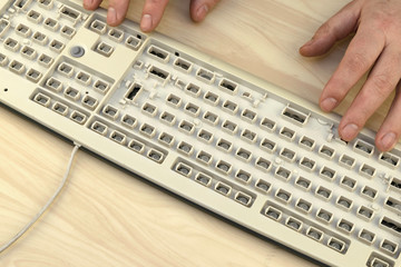 freedom of speech, censorship and bans on the Internet, a man works on a keyboard without keys