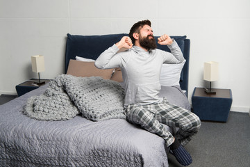 Problem with early morning awakening. Get up early. Tips for waking up early. Man bearded hipster...
